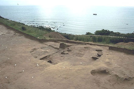 Figure 1 (Click to View): View east over the excavation site to the North Sea.